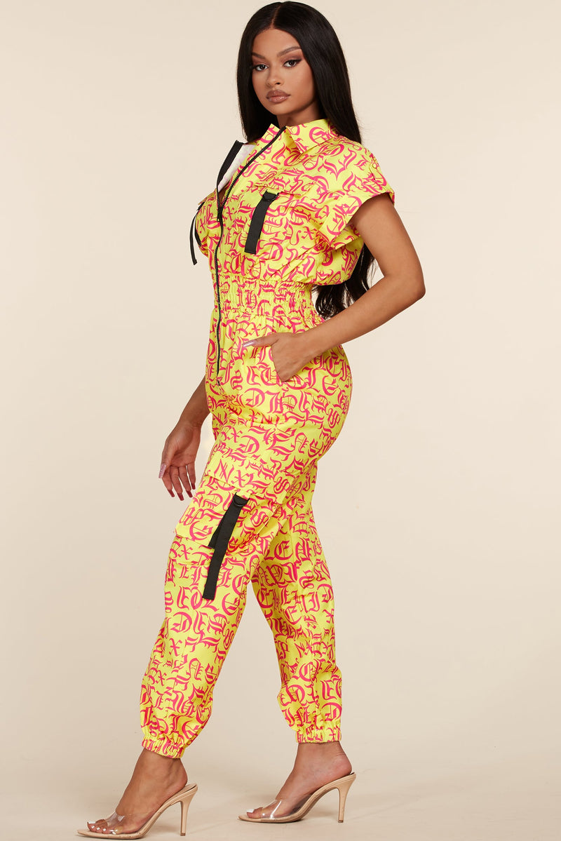 YELLOW JUMPSUIT WITH HOTPINK LETTERS - PRIVILEGE 